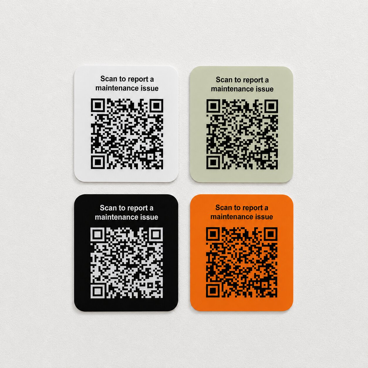 Maintenance QR boards displayed on a white wall.